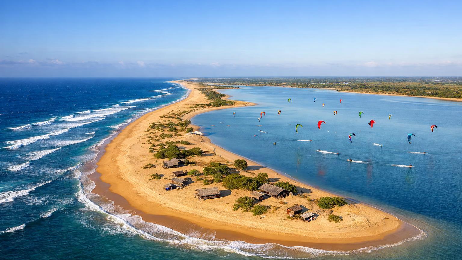 Kalpitiya sand spit with kites over a mirror-flat lagoon
